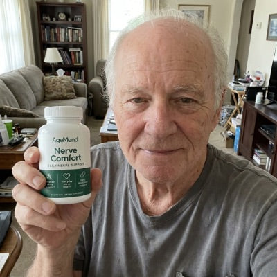 Customer holding a bottle of AgeMend Nerve Comfort